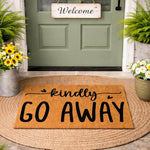Funny Go Away doormat for front porch, a natural coir fiber welcome mat with black script text, placed on a round jute rug outside a green door, perfect for a humorous home entrance decor and outdoor entryway floor mat style.