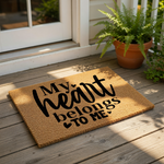 My Heart Belongs To Me coir doormat with black text and heart accents, a durable natural fiber welcome mat for front porch decor that adds a funny and bold statement to your home entryway floor and outdoor house entrance.