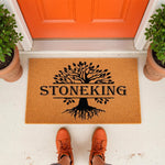 Personalized family name doormat featuring a black tree of life design on a natural coir welcome mat, perfect for a front porch entrance.