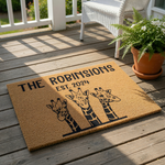 Personalized giraffe family doormat featuring three illustrated giraffes and custom family name text, this durable coir welcome mat is a fun housewarming decor piece for any animal lover looking for a unique front porch entrance