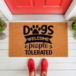 Dogs Welcome People Tolerated doormat featuring a paw print design on natural coir fiber, perfect as a funny front porch welcome mat for pet lovers who want a humorous outdoor rug for their home entrance and entryway decor.