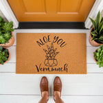 Succulent plant doormat with funny Aloe You Vera Much pun text, featuring a natural coir welcome mat for front porch decor, perfect for housewarming gifts or plant lovers who enjoy cute botanical home entryway floor mats.