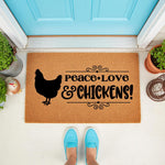 Peace Love and Chickens doormat, a natural coir fiber welcome mat featuring a black hen silhouette and farmhouse typography, placed on a porch in front of a bright blue door for a rustic country home decor look.