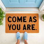 Come As You Are coir doormat for front porch entry, featuring bold black text on a natural fiber welcome mat.