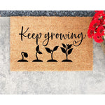 Keep Growing coir doormat featuring a plant growth cycle design, this natural fiber welcome mat for front porch entryways is a durable outdoor rug with a botanical garden theme for plant lovers and home decor enthusiasts.