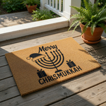 Merry Chrismukkah doormat featuring a black menorah with a Santa hat and gift boxes on a natural coir fiber welcome mat, perfect for holiday home decor and festive front porch entryways during the winter season.