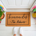 Personalized Bienvenidos doormat for front porch entry, featuring a custom family name design on natural coir fiber.