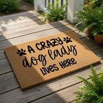 Crazy dog lady doormat with paw print design, a funny coir welcome mat for pet lovers featuring bold black text on a natural fiber rug, perfect for front porch decor or a housewarming present for any dog mom who loves her pets.