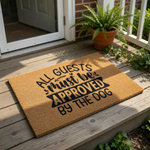 Dog lover doormat with the text All Guests Must Be Approved By The Dog, featuring a natural coir fiber welcome mat design that is perfect for pet owners who want a funny front porch rug for their home entrance and entryway decor.