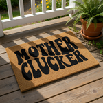 Funny Mother Clucker doormat for front porch, featuring bold black text on a natural coir fiber welcome mat.