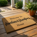 Grandma and Grandpa welcome doormat featuring natural coir fiber material with black printed text that reads Welcome to Grandma and Grandpa's House, a durable outdoor floor mat for a front porch or entryway home decor.