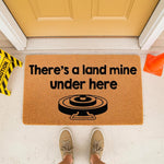 Funny land mine doormat for front porch entry, featuring a humorous warning message and graphic on a natural coir fiber welcome mat, perfect for a sarcastic home decor style that greets guests with a laugh at your front door