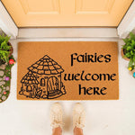 Fairies welcome here doormat featuring a whimsical cottage illustration on natural coir fiber, perfect for a front porch entry.