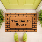 Personalized family name doormat featuring a brick pattern design on natural coir fiber, perfect as a custom welcome mat for your front porch entry, housewarming decor, or a unique personalized home entrance floor mat for new