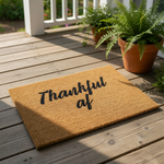 Thankful af doormat, a funny coir welcome mat for your front porch with bold black script text on a natural brown fiber rug, perfect for fall home decor, housewarming entryways, and humorous outdoor floor mat seasonal entryway