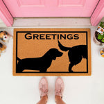 Funny dog butt greetings doormat made of natural coir fiber, featuring a humorous silhouette design of two dogs sniffing each other, perfect for a front porch entrance or as a unique housewarming welcome mat for any dog lover