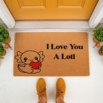Axolotl welcome doormat featuring a cute cartoon axolotl holding a red heart with the text I Love You A Lotl, this natural coir fiber outdoor entry rug is a fun housewarming decor piece for any animal lover or front porch