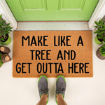 Funny doormat with the text Make Like A Tree And Get Outta Here, a natural coir fiber welcome mat for front porch decor that features bold black lettering and a durable outdoor design for a humorous home entrance or housewarming