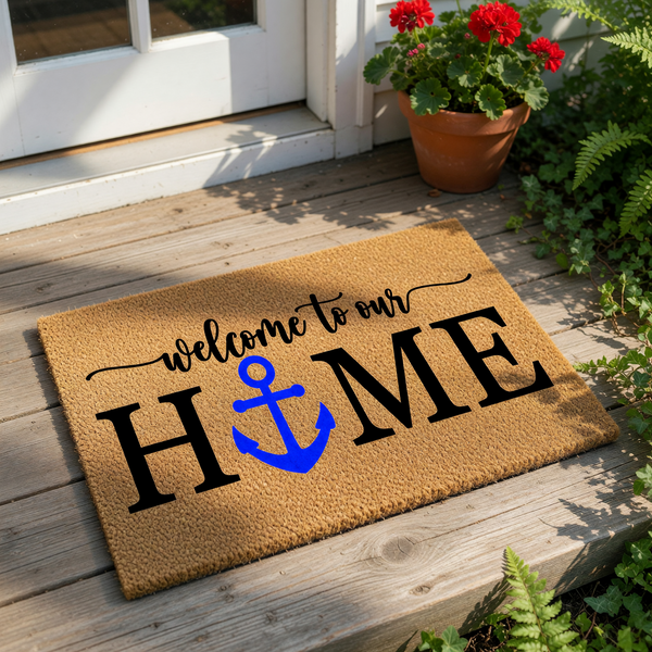 Nautical welcome to our home doormat with a blue anchor replacing the letter O, featuring a natural coir fiber texture for a coastal front porch decor look that serves as a stylish outdoor welcome mat for any beach house or lake