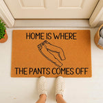 Funny Home Is Where The Pants Comes Off doormat featuring a line art illustration of jeans, this natural coir welcome mat is a humorous front porch decor piece for your entryway, apartment, or housewarming gift for friends and