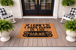 Garage themed doormat with funny quote I Can't I Have Plans In The Garage, featuring wrench and gear icons on natural coir fiber.