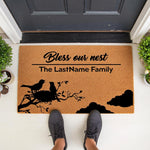 Personalized Bless Our Nest family doormat featuring a bird and nest design on natural coir fiber, perfect as a custom front porch welcome mat for a new home or housewarming entry decor that adds a stylish touch to your front