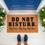 Do Not Disturb doormat with funny quote, a natural coir fiber welcome mat for front porch decor, featuring bold black text that reads My Peace My Joy My Vibes, perfect for a housewarming entry rug or a humorous outdoor floor mat.