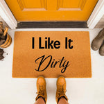 I Like It Dirty funny doormat for front porch entry, featuring bold black text on a natural coir welcome mat.
