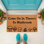 Mushroom welcome doormat with funny pun text on a natural coir fiber mat, featuring a cute woodland fungi design for a front porch entry, perfect for a nature lover home decor style and a whimsical outdoor entrance floor mat.