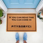 Funny welcome doormat with humorous text on a natural coir fiber mat, featuring a black border and bold lettering for a front porch entry.