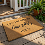 Nana and Pop personalized doormat featuring natural coir fiber texture with black printed text that reads There is no place like Nana and Pop's house, a custom outdoor welcome mat for grandparents and family home entryway decor.