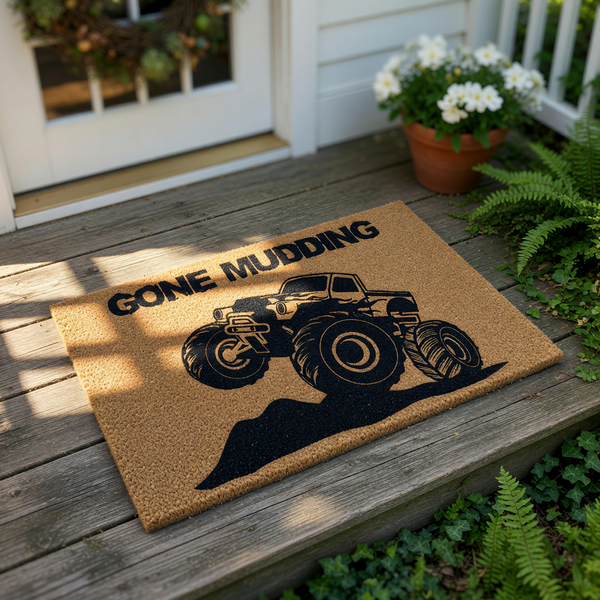 Gone Mudding monster truck doormat featuring a rugged off-road vehicle design on natural coir fiber, this funny outdoor welcome mat is a great front porch decor choice for truck enthusiasts and off-road racing fans who love
