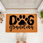Grandma dog doormat featuring a paw print design on natural coir fiber, this personalized welcome mat for pet lovers makes a fun front porch decor piece for any dog grandma who loves her furry friends and home entryway style.