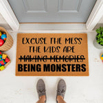 Funny Excuse The Mess doormat for front porch, featuring a humorous quote about kids being monsters.