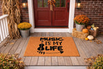 Music Is My Life doormat featuring a violin graphic on a natural coir welcome mat, displayed on a fall porch with pumpkins and autumn decor, perfect for a musician home entrance or a unique outdoor floor mat for music lovers.