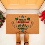 Funny Christmas doormat featuring festive holiday text and reindeer antlers on a natural coir welcome mat, perfect for a seasonal front porch entry decor update that adds a humorous touch to your home entrance during the winter