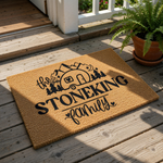Personalized camping family doormat featuring a travel trailer, mountains, and pine trees on natural coir fiber, making a custom outdoor welcome mat for campers, RV owners, and outdoor enthusiasts who love nature and adventure.