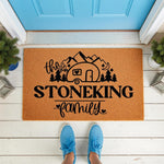 Personalized camping family doormat featuring a camper, mountains, and trees design on a natural coir welcome mat, perfect for outdoor porch decor and custom home entryways for those who love the outdoors and travel adventures.