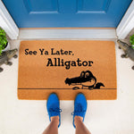 See Ya Later Alligator doormat featuring a cute cartoon crocodile graphic on natural coir fiber, perfect for a funny front porch welcome mat or outdoor entrance rug that adds a playful touch to your home decor and entryway floor.