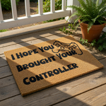 Gamer welcome doormat featuring the text I Hope You Brought Your Controller with a video game controller icon, this natural coir fiber welcome mat is a funny housewarming decor piece for any gaming room or front porch entrance.