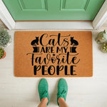 Cat lover doormat with funny quote Cats Are My Favorite People printed on natural coir fiber, featuring black cat silhouettes for a cute entryway welcome mat design that is perfect for any feline owner home decor front porch.