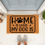 Home Is Where My Dog Is doormat featuring a paw print design on natural coir fiber, perfect as a funny pet lover welcome mat for your front porch entry, durable outdoor floor rug for dog owners who love cute animal home decor.