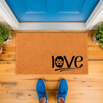 Paw print love doormat for pet lovers, featuring a natural coir fiber welcome mat with a black paw print design on a front porch, perfect as a dog or cat themed entryway rug for your home decor and housewarming entrance.