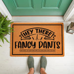 Hey There Fancy Pants coir doormat featuring a funny welcome message in black text on a natural fiber rug, placed on a front porch for a humorous entryway decor look that greets guests with a stylish and witty outdoor floor mat
