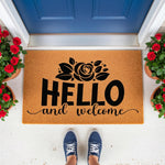 Floral Hello and Welcome doormat featuring a black rose design on natural coir fiber, perfect as a front porch welcome mat or outdoor entryway rug for a stylish home entrance with potted red roses and a blue door in the