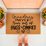 Grandma doormat with funny quote about hugs and cookies, a natural coir fiber welcome mat for front porch decor.