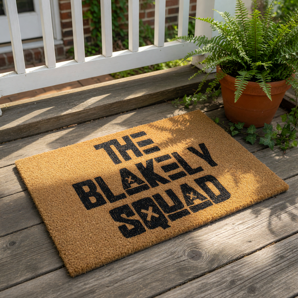 Personalized family name doormat featuring bold black text on a natural coir fiber welcome mat, perfect for a front porch entry.