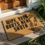 Christmas doormat with Wipe Your Boots Here Santa text and boot prints on a natural coir fiber welcome mat, perfect for holiday porch decor and festive entryway floor mats to keep your home clean during the winter season.