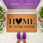 Personalized Mr. and Mrs. wedding doormat with a heart home design, featuring durable natural coir fiber construction for a stylish front porch entrance, perfect as a custom housewarming gift for a newlywed couple moving into a