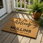 Personalized family name welcome doormat featuring a natural coir fiber texture, custom text for a housewarming entry, and a durable outdoor floor mat design that makes a stylish front porch decor piece for any new home entrance.